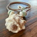 Image of Hawaiian Ivory Drupe Shell Necklace with Puka Shells, Teal Seaglass (22 inch)