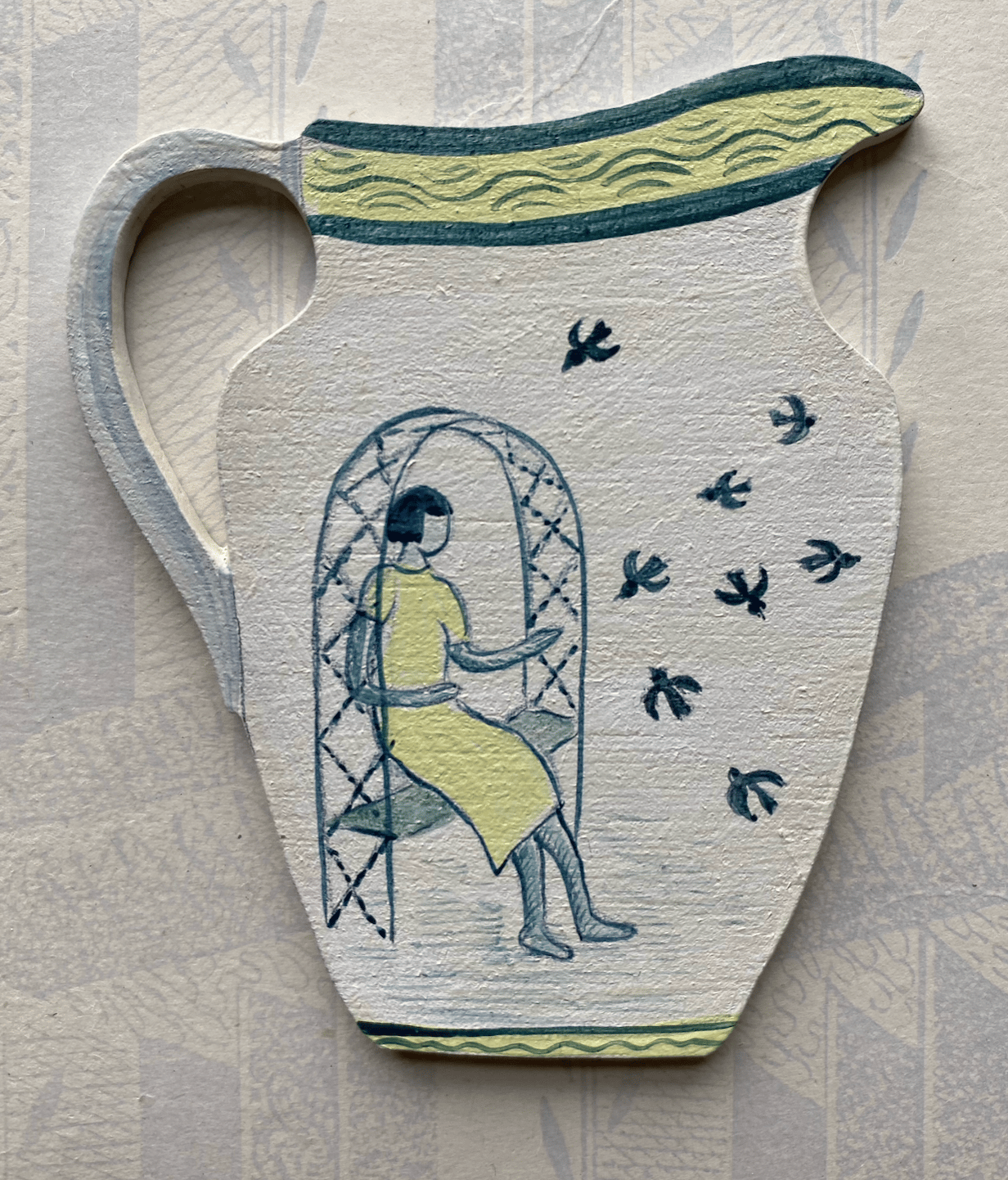 Image of Tiny jug decoration feeding the birds