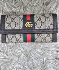 Brown standard wallet with stripes