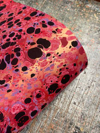 Image 2 of 'Molten Rock' // one-of-a-kind hand marbled paper on red base paper 