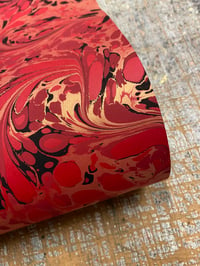 Image 3 of 'Fiery Swirl' // one-of-a-kind hand marbled paper on red 