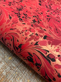 Image 4 of 'Fiery Swirl' // one-of-a-kind hand marbled paper on red 