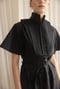 Image of black cube dress with detail 