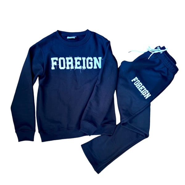 Image of Black crew neck with semi flare pant distressed logo 
