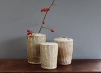 Incised set of three stem Vases.  