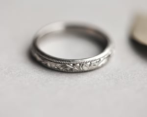 Image of Platinum 3mm Floral and milled edge engraved ring