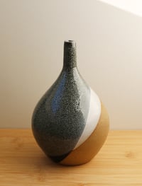 Image 1 of asymmetrical criss cross vase