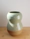 Image of tall celadon wavy vase