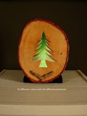 Image of Rustic Bass Wood with Pine Base, LED light behind a pine tree sihlouette, Rustic Table Decor