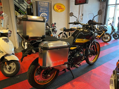 Image of 2024 Himalayan 450 in Hanle Black displayed with the optional Adventure Kit