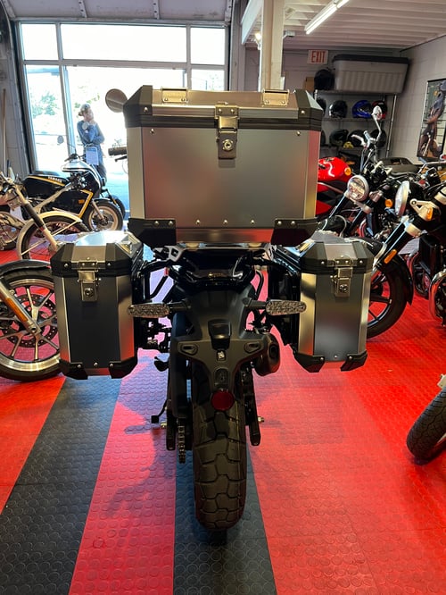 Image of 2024 Himalayan 450 in Hanle Black displayed with the optional Adventure Kit