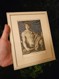 Image 1 of "John the Baptist" antique page with preserved spider web