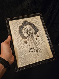 Image 1 of "Skull Spider" original art on a 1800's bible page with preserved spider web - B