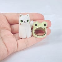 Image 4 of white cat with frog hat ceramic figurine