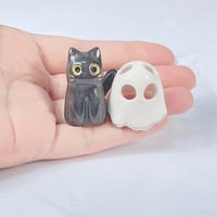 Image 4 of Glow in dark black kitty with ghost mask ceramic figurine white gold edition 