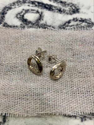 Image of "Orbital Bone" molten silver studs