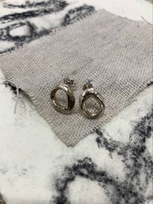 Image of "Orbital Bone" molten silver studs