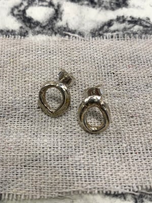 Image of "Orbital Bone" molten silver studs