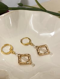 Golden frame earrings