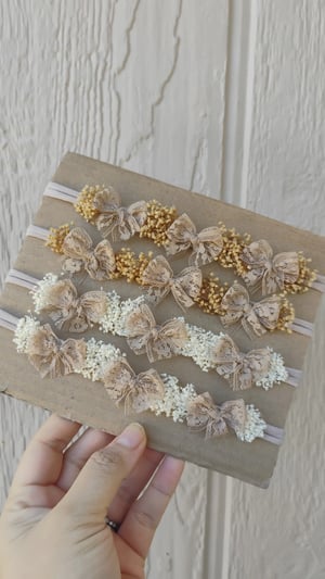 Image of Latte lace multiple bows tieback with babies breath