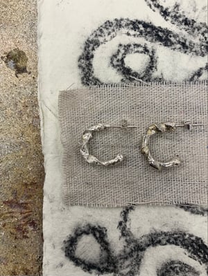 Image of "The Centre Cannot Hold" molten silver hoops