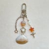 shell swirl orange tint keychain