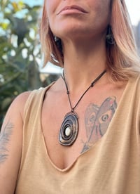 Image 5 of Inner strength. Limpet-inspired pendant with white howlite stone