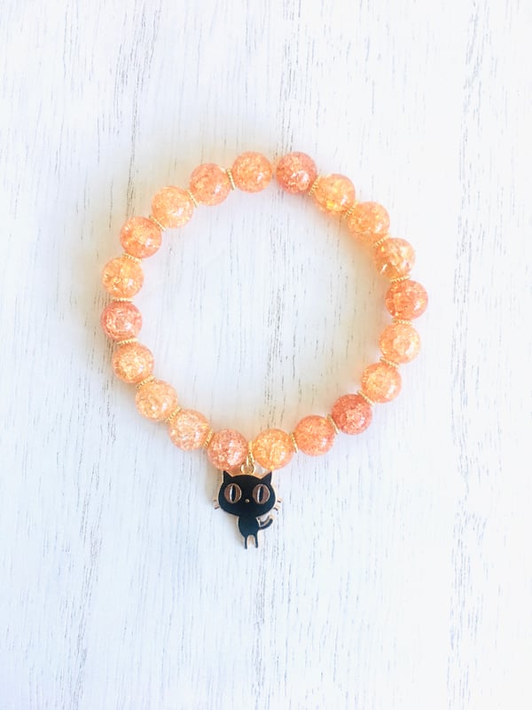 Image of Orange beaded Cat charm stretch bracelet 