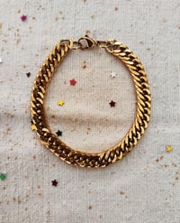 Image 1 of Bracciale in acciaio dorato