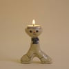 Cheeky side-eye boy candle holder 