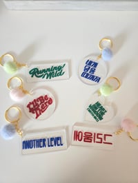HAPPY TRACK LIST KEYRING 