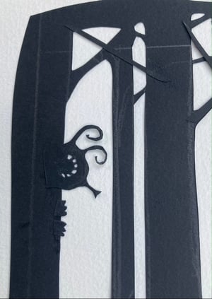 Image of original paper cut-out "Flyboy following the octopus through the forest"