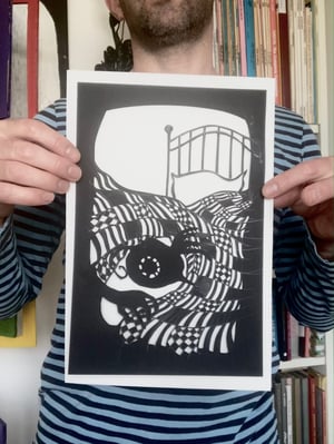 Image of original paper cut-out "Flyboy hiding under the covers"