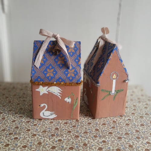 Image of Papier Mâché Christmas house with gold detail on roof