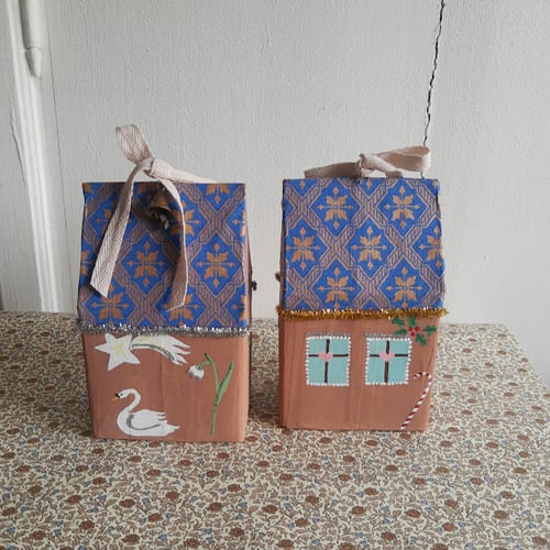 Image of Papier Mâché Christmas house with gold detail on roof