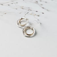 Image 1 of Dainty silver and gold circle earrings