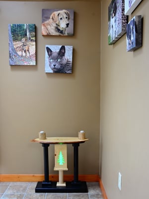 Image of Handmade Wooden Live Edge End Table with color changing LED lights, Carved deer antler and pine tree