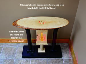 Image of Handmade Wooden Live Edge End Table with color changing LED lights, Carved deer antler and pine tree