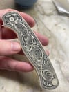 Resin casting of Spyderco Egyptian engraved knife 