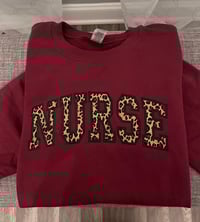 Image 1 of Embroidered Nurse Sweatshirt