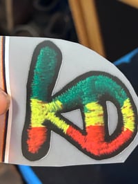 Image 4 of KD Rasta hat. Dwellers on the strap