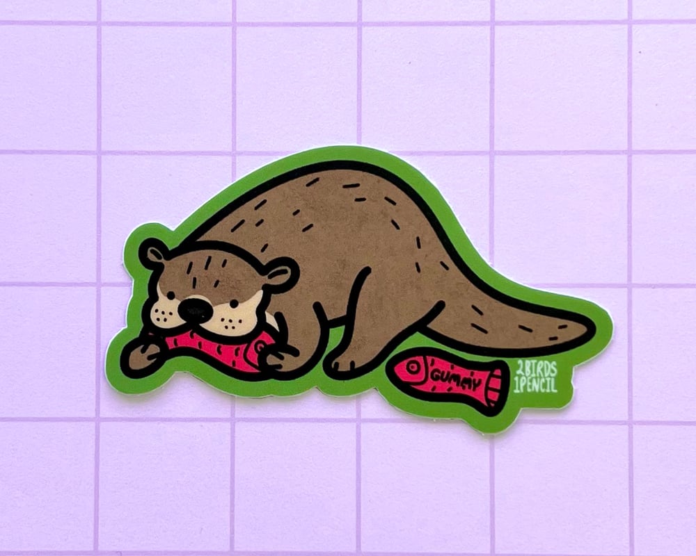 Image of Otter with a gummy snack vinyl sticker