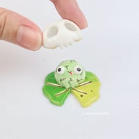 Image 1 of Happy zombie frog on lily pad with Skull mask ceramic figurine