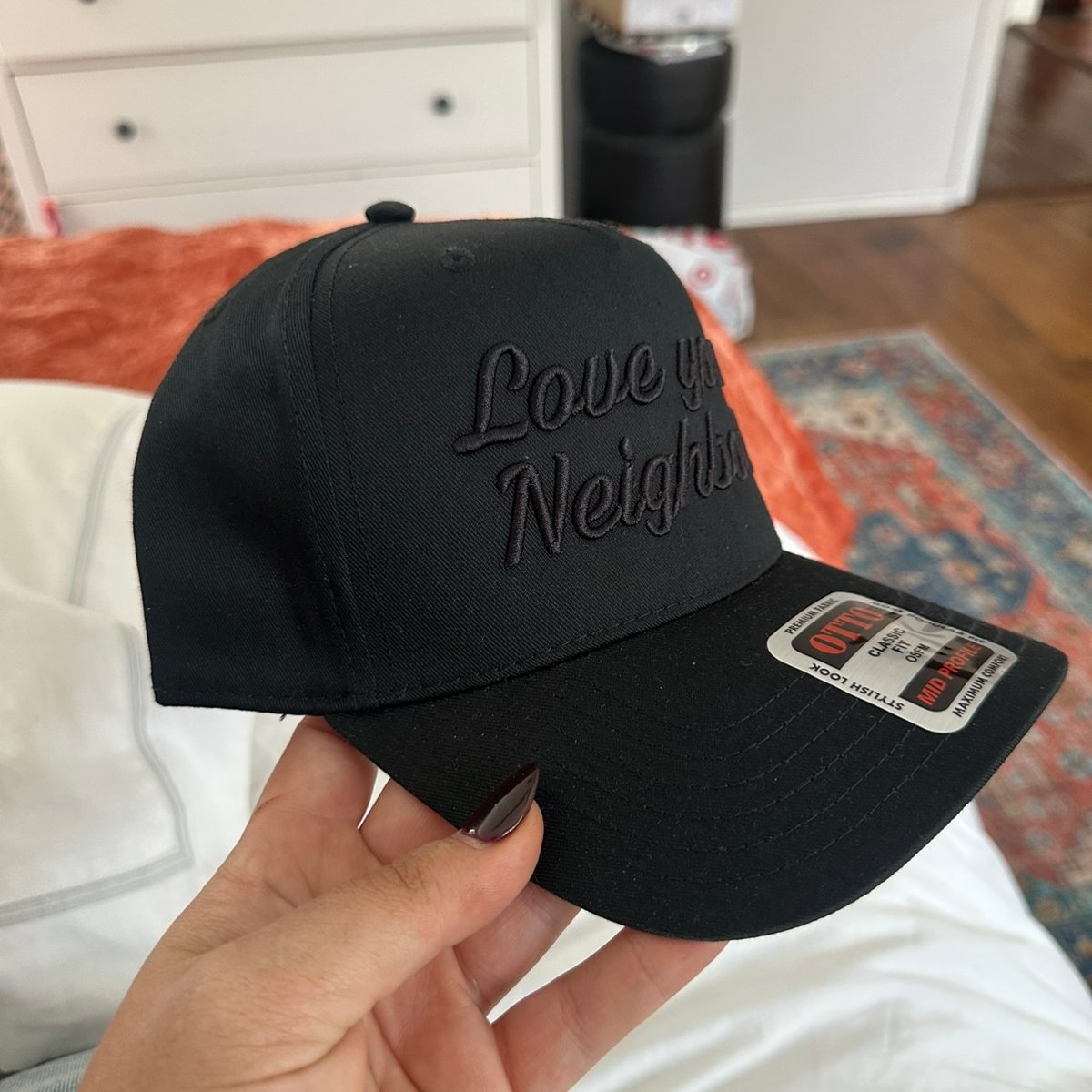 Image of black on black hat