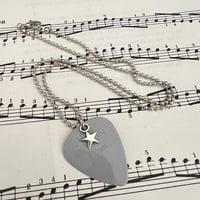 Carl Barât used guitar pick necklace 