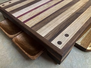 Image of Walnut, Maple and Purple Heart Raised Cutting Board with catch bowls and plate, Chopping Board