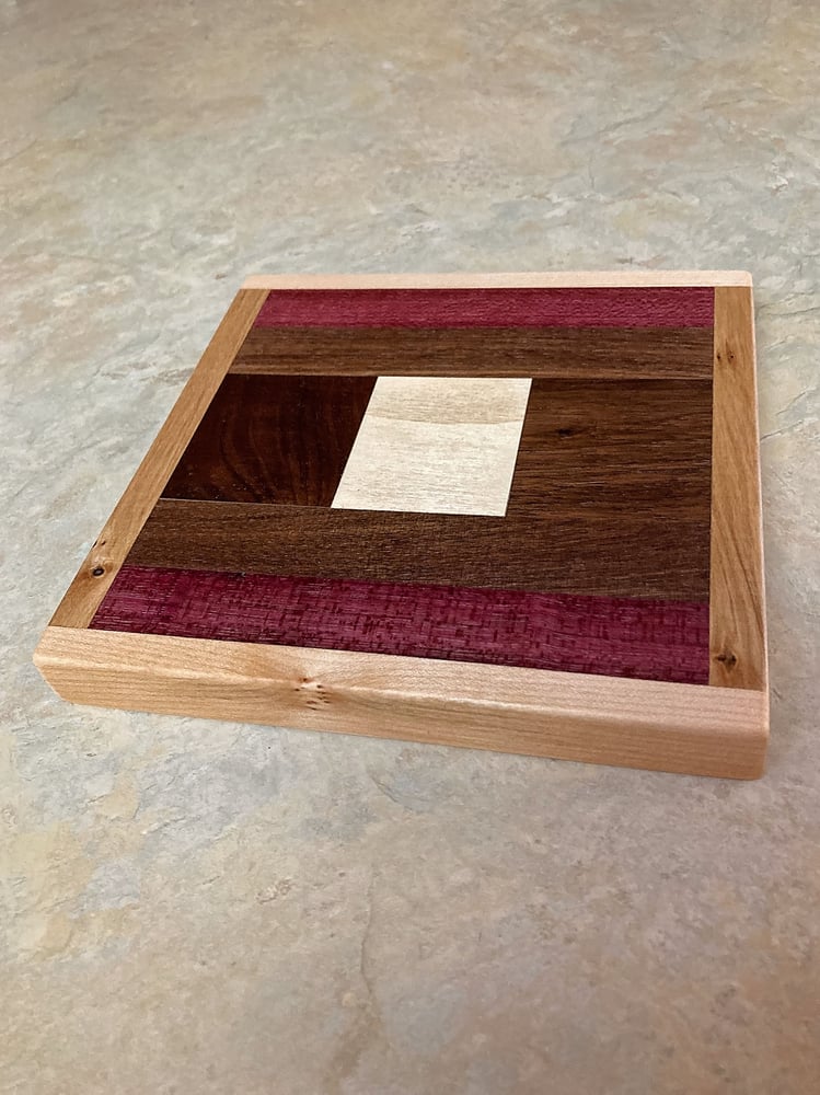 Image of Wooden Trivet of Dark Walnut, Maple, Purple Heart with Pine in center