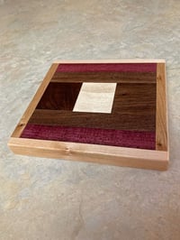 Image 1 of Wooden Trivet of Dark Walnut, Maple, Purple Heart with Pine in center