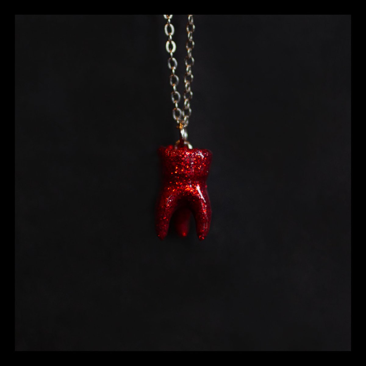 LIMITED EDITION: 3-root molar necklace in Ruby
