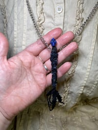 Image 1 of Mini protection voodoo doll necklace. 